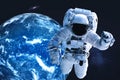 Astronaut near night Earth planet in outer space Royalty Free Stock Photo