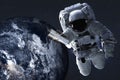 Astronaut near night Earth and satellite in outer space Royalty Free Stock Photo