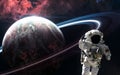 Astronaut orbiting planet in deep space