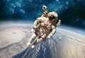 Astronaut in outer space against the backdrop of the planet eart Royalty Free Stock Photo