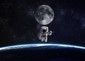 Astronaut in outer space against the backdrop of