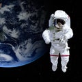 Astronaut in outer space against the backdrop of