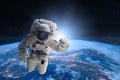 Astronaut in outer space on background of the Earth. Royalty Free Stock Photo