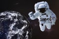 Astronaut in outer space near night Earth Royalty Free Stock Photo