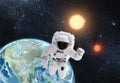 Astronaut in outer space over the planet earth. This image is a Royalty Free Stock Photo