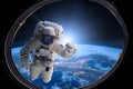 Astronaut in outer space from porthole on background of the Earth. Elements of this image furnished by NASA