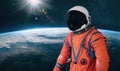 Astronaut in the outer space with Sun over the planet Earth. Royalty Free Stock Photo