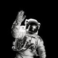 Astronaut in outer space waving his hand to the camera. Royalty Free Stock Photo