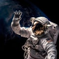 Astronaut in outer space waving his hand to the camera. Royalty Free Stock Photo