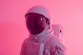 Astronaut in pink space uniform. Generate ai