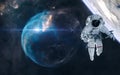 Astronaut and planet in deep space on background Bubble Nebula. Science fiction