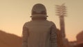 Astronaut on the planet Mars at sunset. Travel future concept