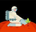 Astronaut is planting tree on Mars. spaceman planting plant