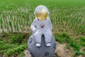 Astronaut sculpture on the field. Royalty Free Stock Photo