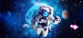 Astronaut in space in the solar system Earth. Blue light on background. Elements of this image furnished by NASA Royalty Free Stock Photo