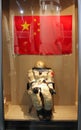 Astronaut space suit on a background of Chinese flag in the Inner Mongolia Museum