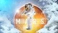 Astronaut float in outer space over of the planet Mars on the background. Elements of this image furnished by NASA.
