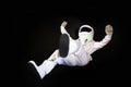 Astronaut in space, in zero gravity on black background.