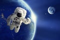 Astronaut or Spaceman floating in space with Earth planet and moon background