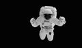 Astronaut in a spacesuit flies on black background. Hands are raised up.Elements of this image furnished by NASA Royalty Free Stock Photo