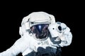 Astronaut in a spacesuit isolated on a black background. Elements of this image were furnished by NASA. Royalty Free Stock Photo