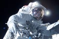 Astronaut in a spacesuit in open space. Elements of this image were furnished by NASA Royalty Free Stock Photo