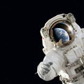 Astronaut Spacewalking with Earth Reflection in Visor Helmet Royalty Free Stock Photo