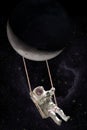 Astronaut swings on a rope swing attached to the moon