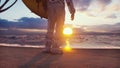 An astronaut is about to surf on a surfboard in the endless ocean on an alien planet. The image is for fantastic, the Royalty Free Stock Photo