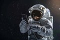 Astronaut using mobile phone in space, Generative AI