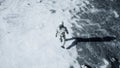 The astronaut is walking on a new unknown snow planet under alien constellations and nebulae. Animation for fantasy