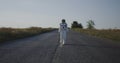 Astronaut walking on road