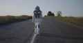 Astronaut walking on road