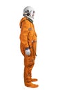 Astronaut wearing orange space suit and space helmet isolated on a white background. Side view Royalty Free Stock Photo