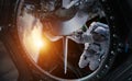 Astronaut working on a space station 3D rendering elements of th