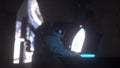 Astronaut works on his laptop in futuristic spaceship. 3d rendering