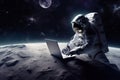 An astronaut works on his laptop in space