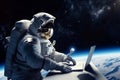 An astronaut works on his laptop in space