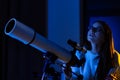 Astronomer woman setting telescope