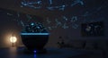 Astronomical night sky projection device indoors showing constellations in a darkened room setting Royalty Free Stock Photo
