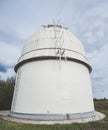 Astronomical observatory radio telescope design in the fields in early spring in cloudy weather