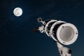 Astronomical telescope over dark sky with the moon Royalty Free Stock Photo