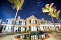 Star trails above a large house in Bermuda, Royalty Free Stock Photo