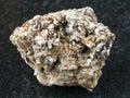 Astrophyllite crystals in raw Natrolite on dark