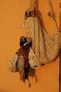 A Stuffed bird along with braided shoes and baskets in South Korea.