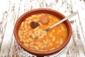 Asturian bean stew in a clay pot. Royalty Free Stock Photo
