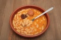 Asturian bean stew in a clay pot. Royalty Free Stock Photo