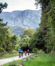 Riding bikes in family through Natural Park in Asturias. Royalty Free Stock Photo