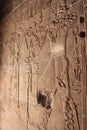 Ancient Egyptian writing, Egyptian hieroglyphs, wall inscriptions and god images, Aswan, Egypt, close to the Nile River Royalty Free Stock Photo