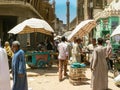 Aswan, Egypt - August 16, 2019. View of a street of the Aswan market with various vendors of everyday items Royalty Free Stock Photo